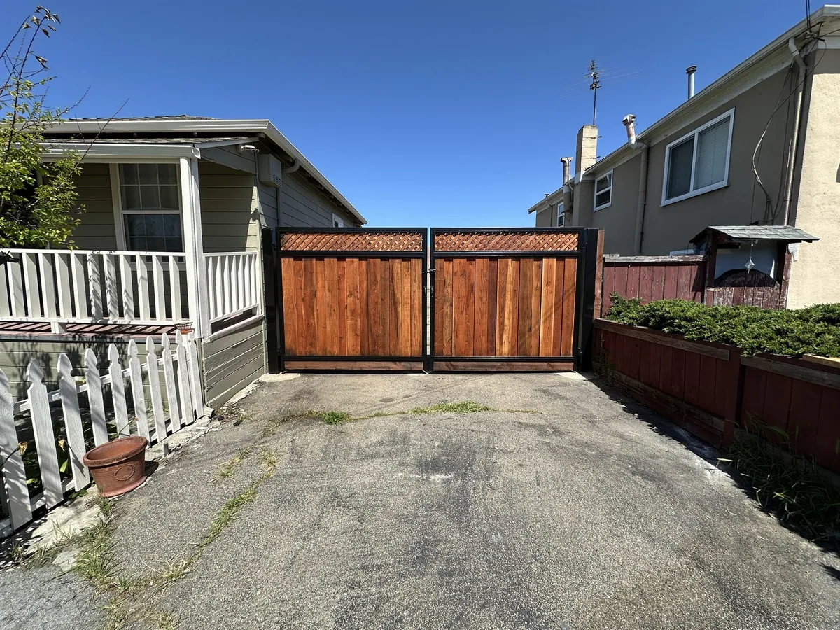Wood gate in a metal frame from the existing Pro Fence gallery